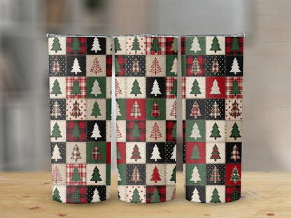 Three tumblers with a patchwork pattern of Christmas trees and plaid designs.