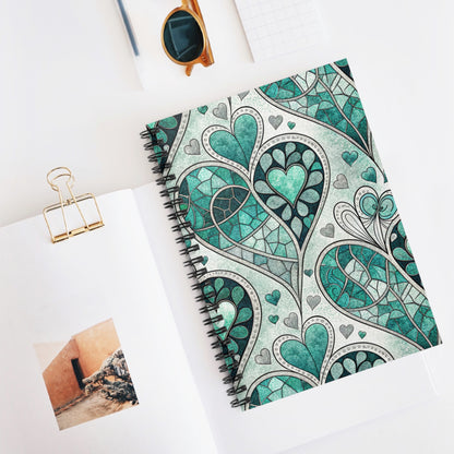 Spiral notebook with a teal and grey heart mosaic stained glass pattern.