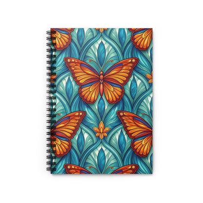 Spiral-bound notebook with a colorful butterfly and teal floral pattern.