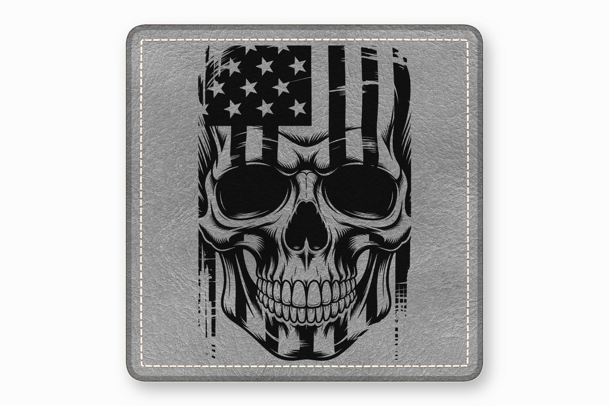 A gray leather square patch featuring a black-and-white distressed skull and American flag graphic.