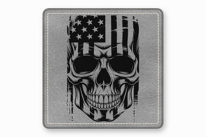 A gray leather square patch featuring a black-and-white distressed skull and American flag graphic.