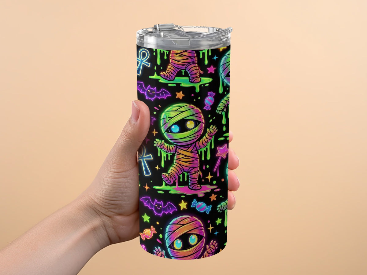 Tumbler with glowing mummy, bats, candy, and Egyptian ankh pattern.
