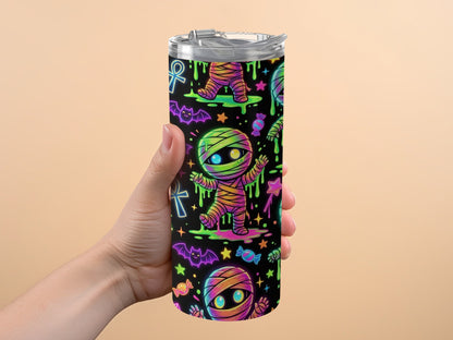 Tumbler with glowing mummy, bats, candy, and Egyptian ankh pattern.