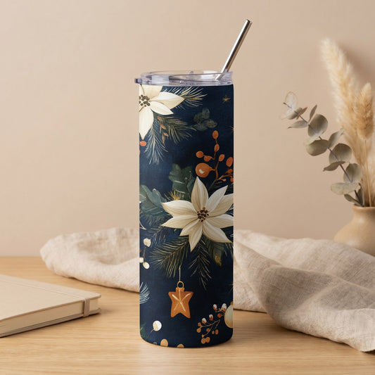 Dark blue tumbler with white poinsettias, pine needles, and ornaments.