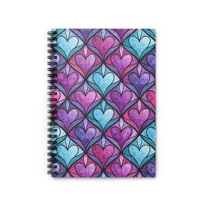 Spiral notebook with a stained glass-inspired heart pattern in purple and blue.