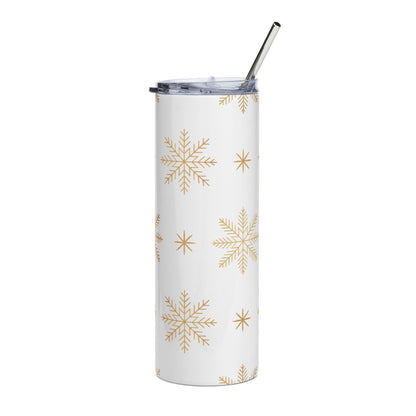 White tumbler with gold snowflake pattern and metal straw.