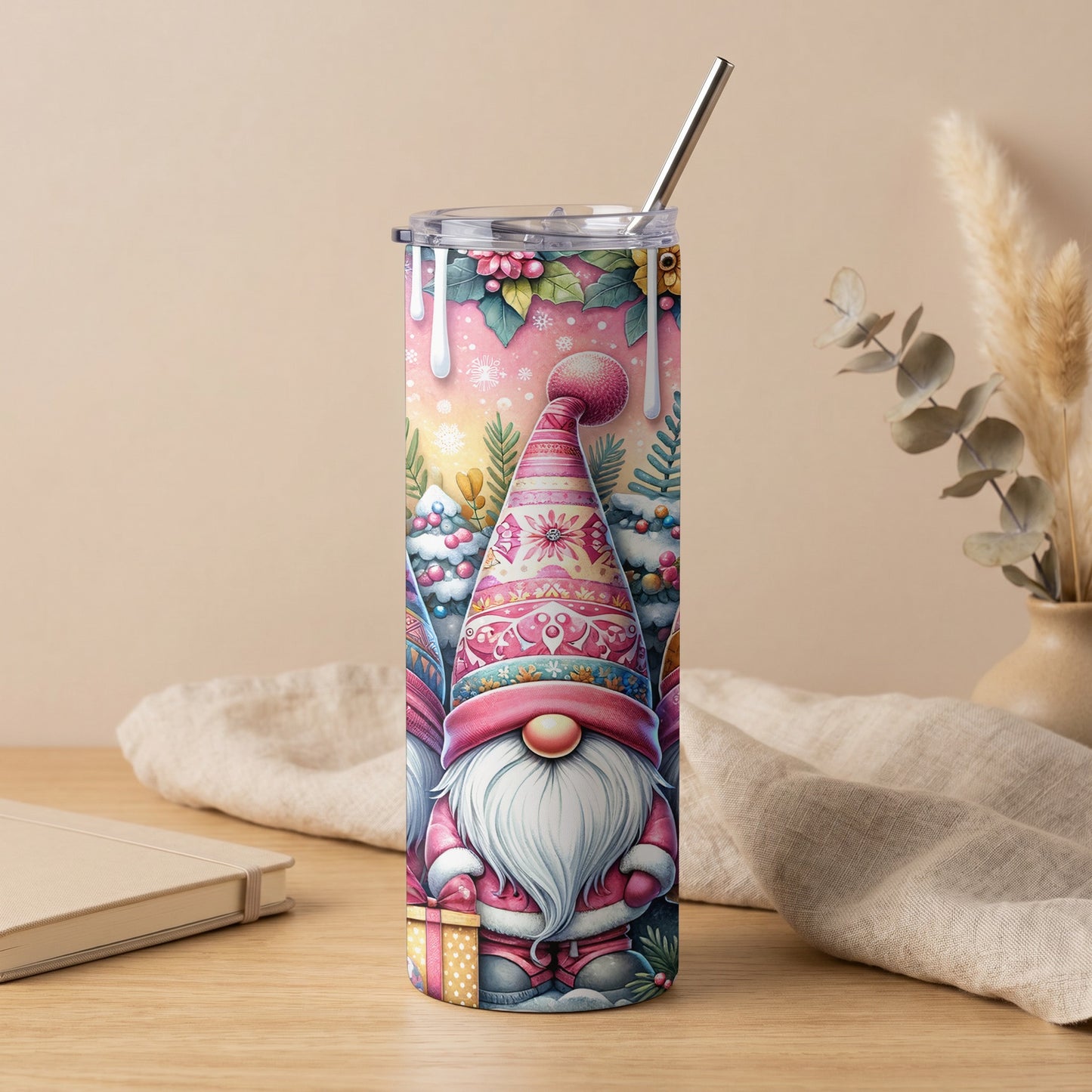 Tall tumbler with watercolor gnomes, Christmas trees, and gifts on a pink background.