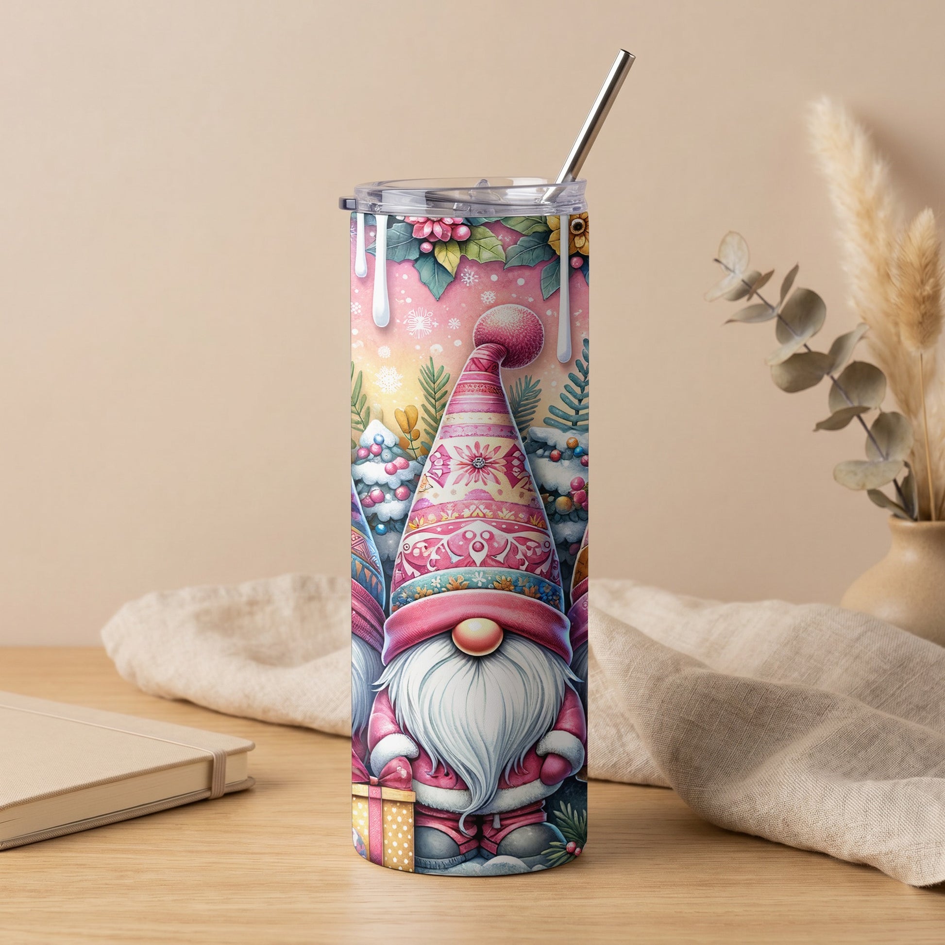 Tall tumbler with watercolor gnomes, Christmas trees, and gifts on a pink background.