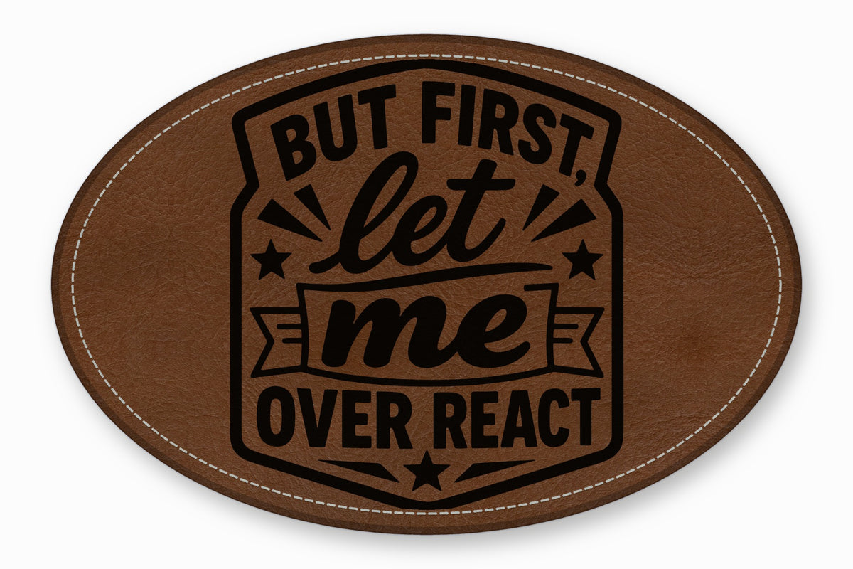 An oval brown leather patch with white stitched edges and black text reading But first let me overreact.