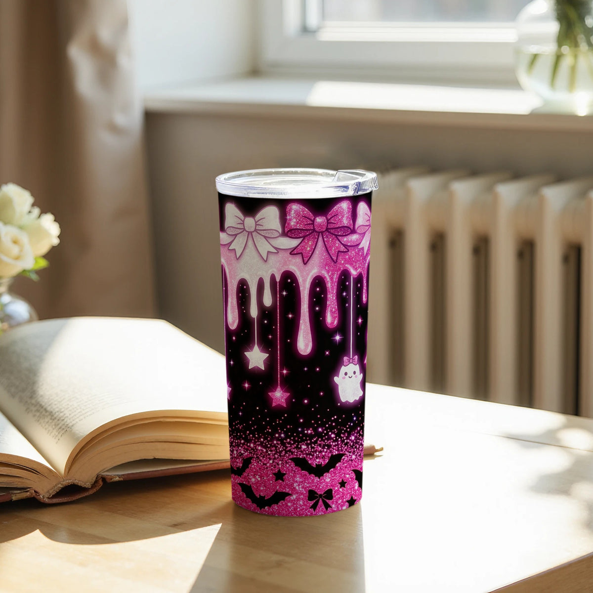Pink glitter tumbler with bows, dripping accents, ghost, stars, and bats.