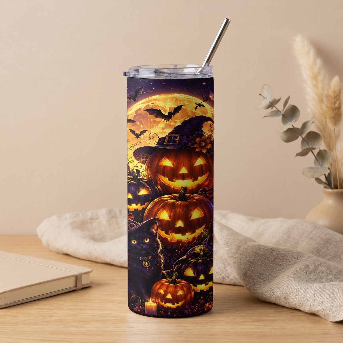 Tall tumbler with a Halloween design featuring pumpkins, a black cat, and bats under a full moon.