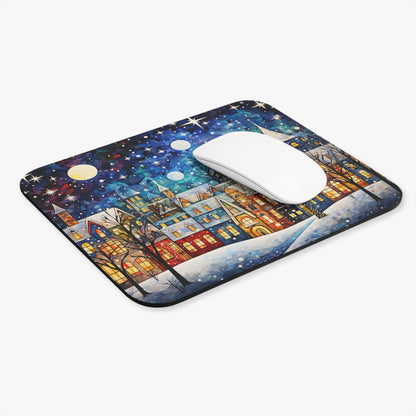 Mousepad with a colorful winter village scene under a starry night sky.