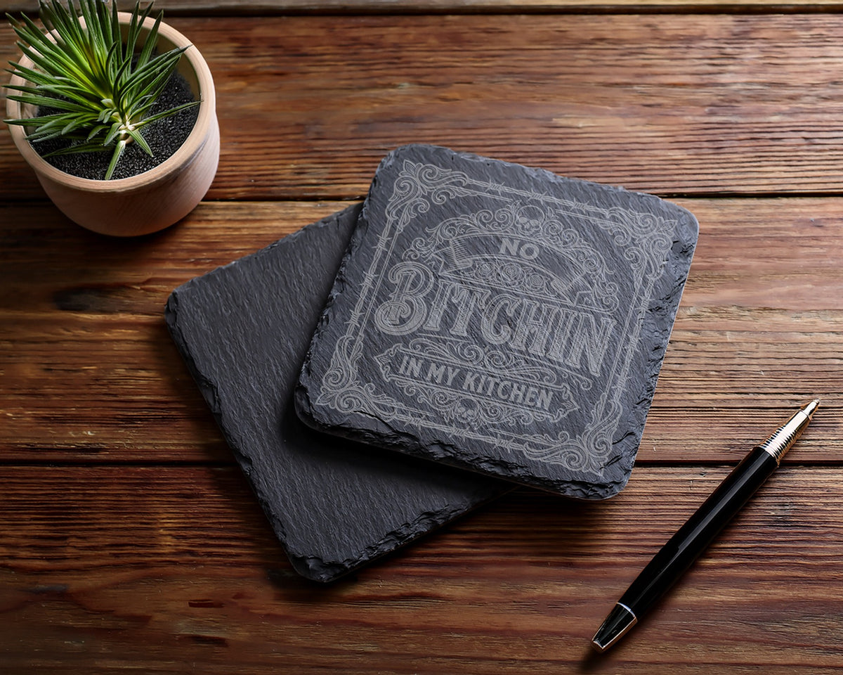 Square slate coasters with "No Bitchin In My Kitchen" etched on top coaster.