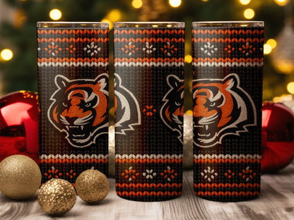 Three tumblers with tiger face and knitted pattern.