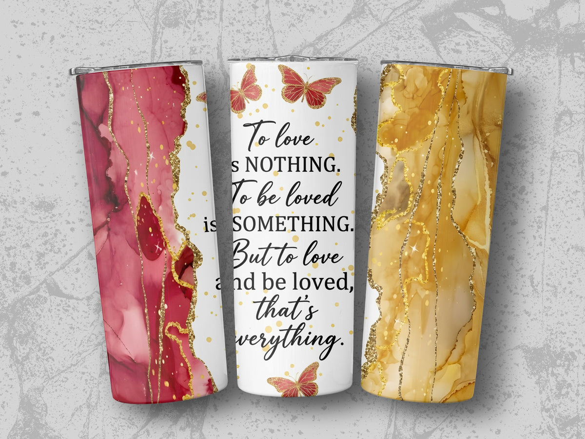 Tumblers with red and gold abstract designs and butterfly quote.