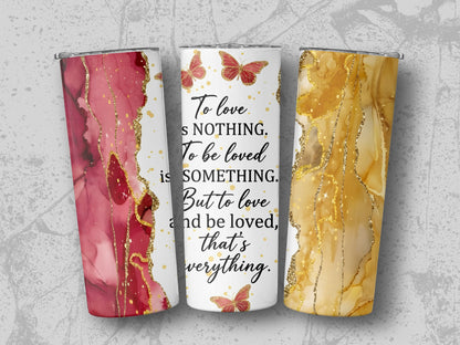 Tumblers with red and gold abstract designs and butterfly quote.