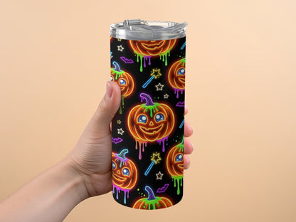 Tumbler with neon Halloween pattern of pumpkins, bats, and stars.