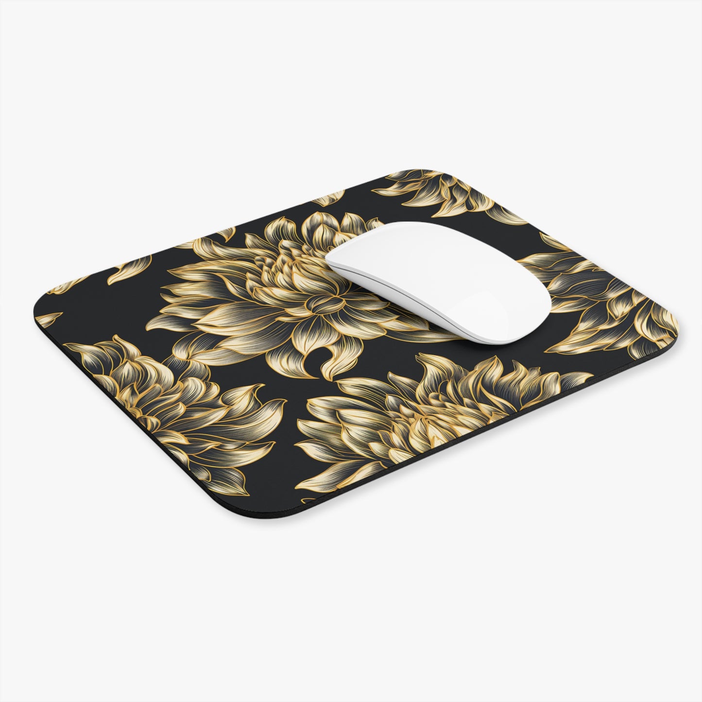 Black mousepad with a gold floral pattern and a white mouse.