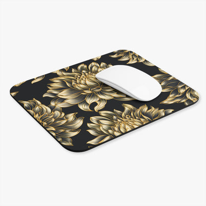 Black mousepad with a gold floral pattern and a white mouse.