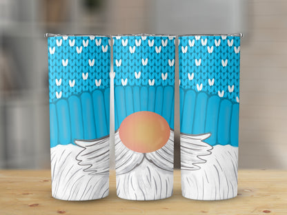Three tumblers with a cartoon gnome design featuring a blue knitted pattern and white beard.