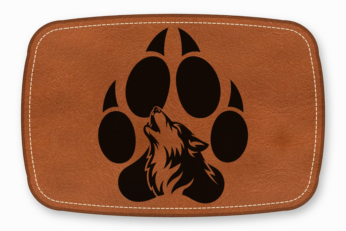 Brown rectangular leather patch featuring a black wolf howling within a paw print design, bordered by white stitching.