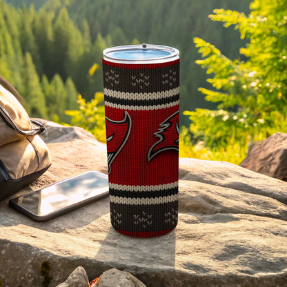 Red, white, and black knit pattern tumbler with a logo on a rock.