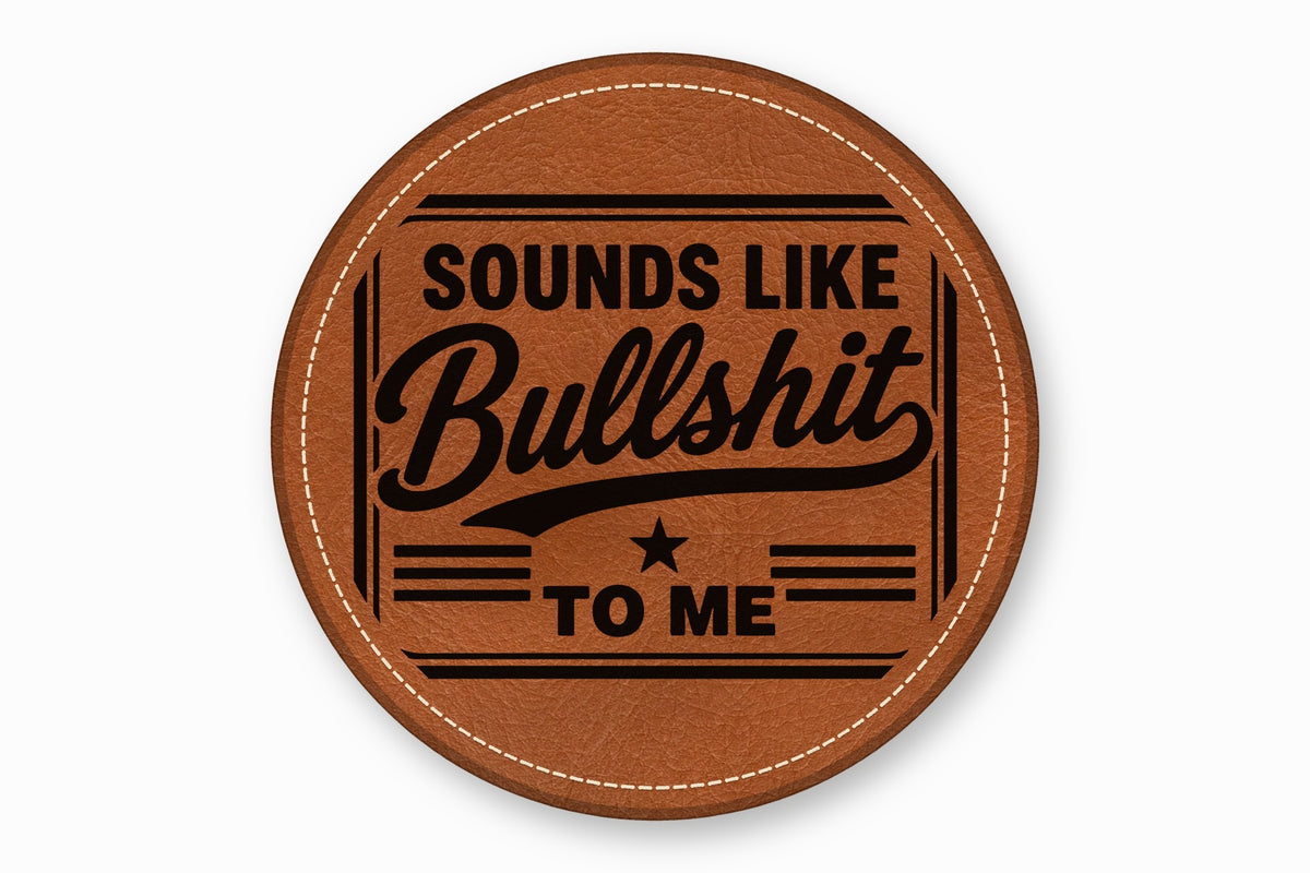 A round brown leather patch with white stitched edges features the text Sounds Like Bullshit To Me.