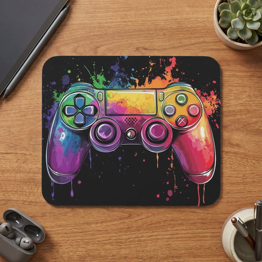 Video game controller with colorful paint splatters on a black background.