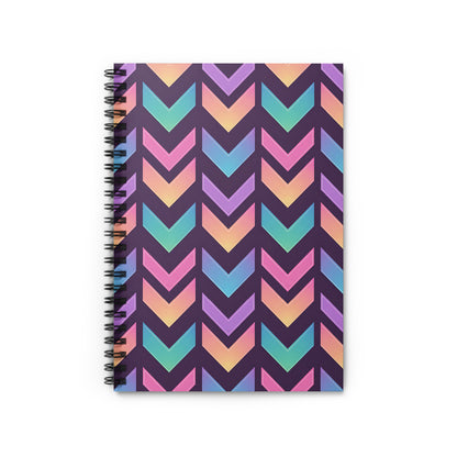 Notebook with a dark purple cover featuring a chevron pattern in pastel rainbow colors.
