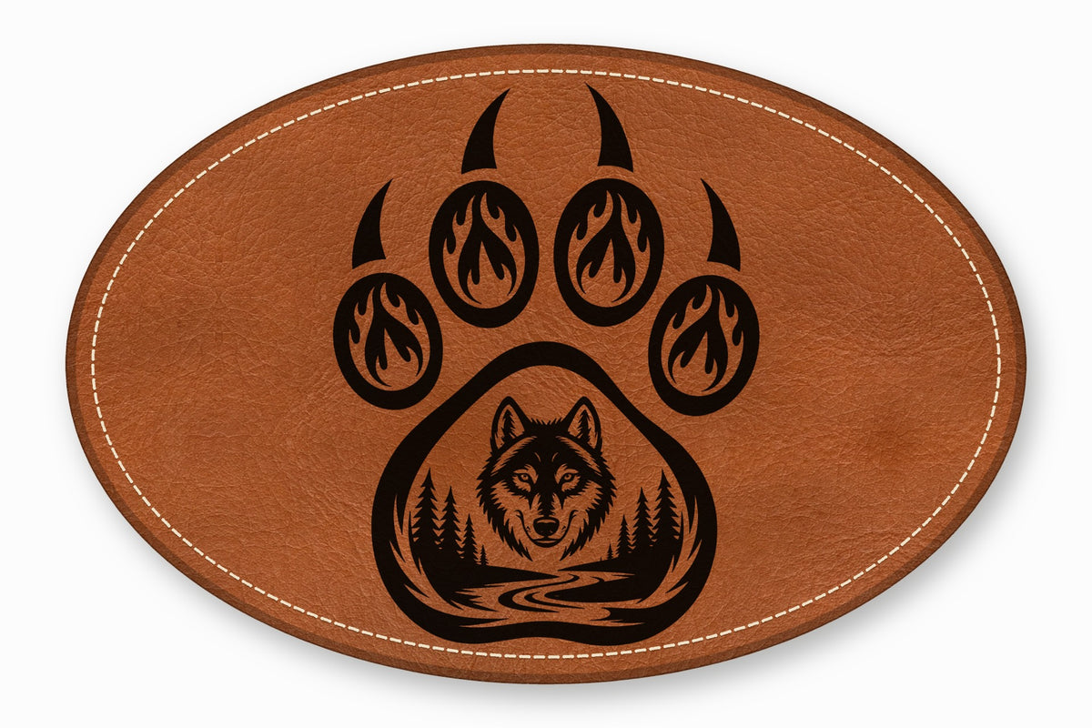 Oval brown leather patch with white stitched border featuring a black bear paw and wolf silhouette.