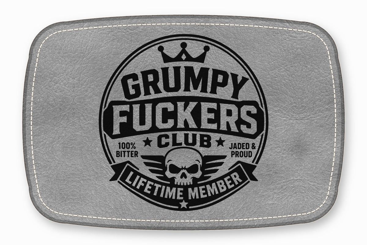Gray leather patch featuring a black stamped emblem with a skull, crown, and text.