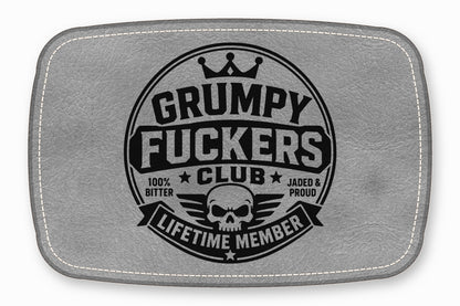 Gray leather patch featuring a black stamped emblem with a skull, crown, and text.