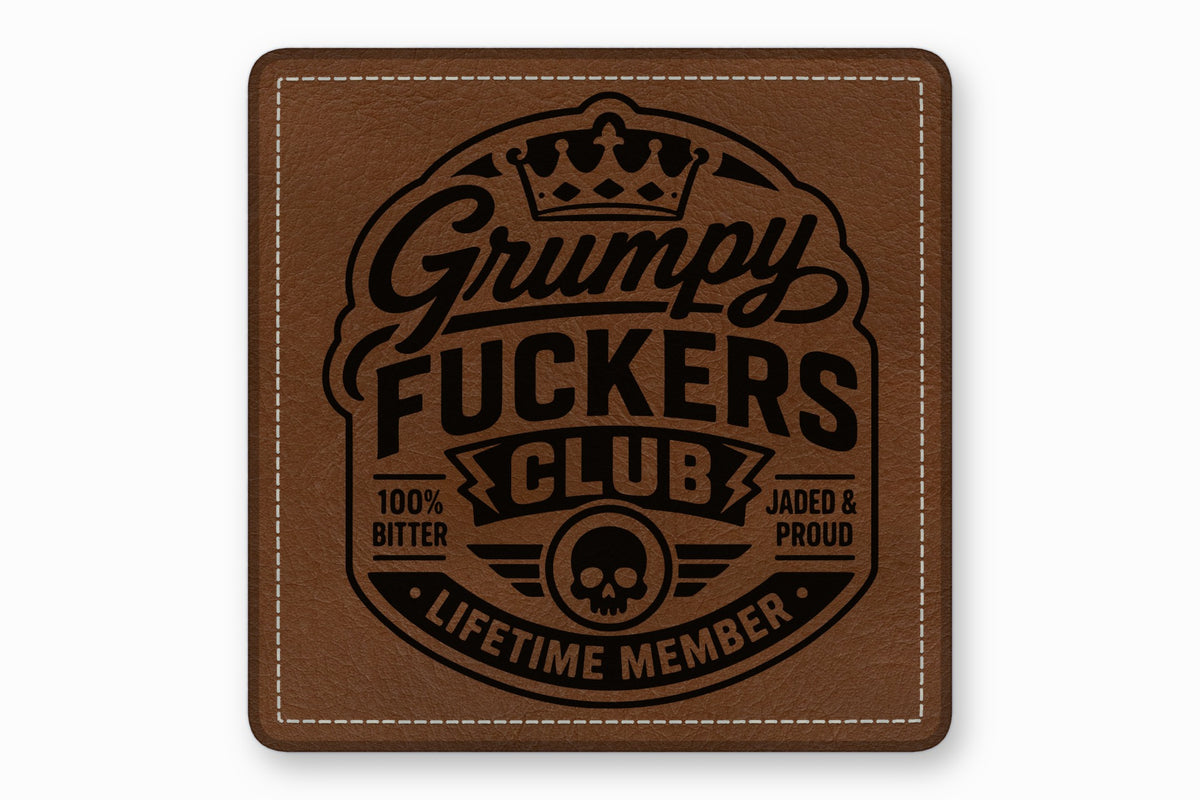 Brown square leather patch featuring a black embossed design with a skull, crown, and text reading Grumpy Fuckers Club.