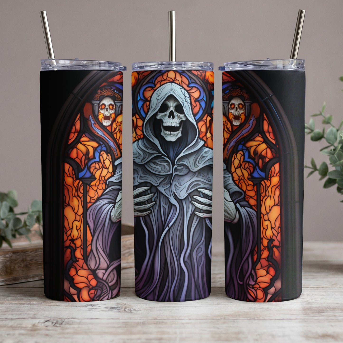 Three tumblers featuring a grim reaper design with stained glass and skulls.