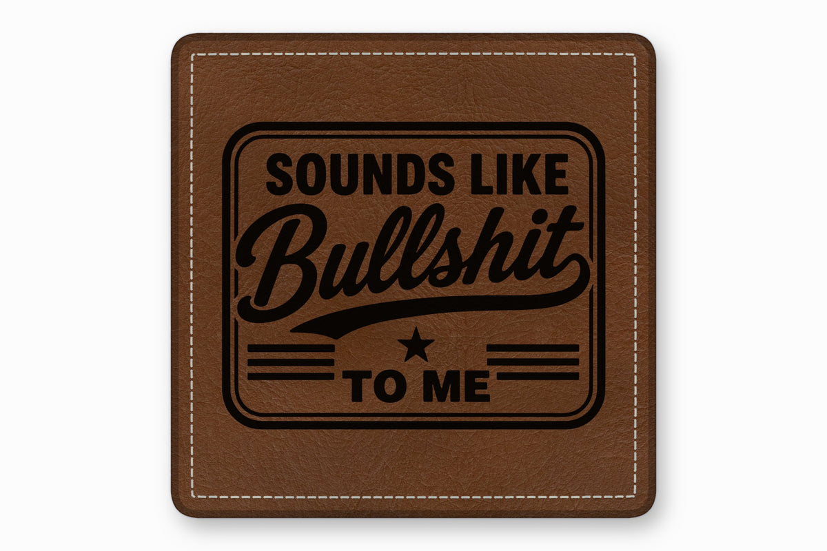 Brown square leather patch with white stitched border and the engraved text Sounds Like Bullshit To Me.