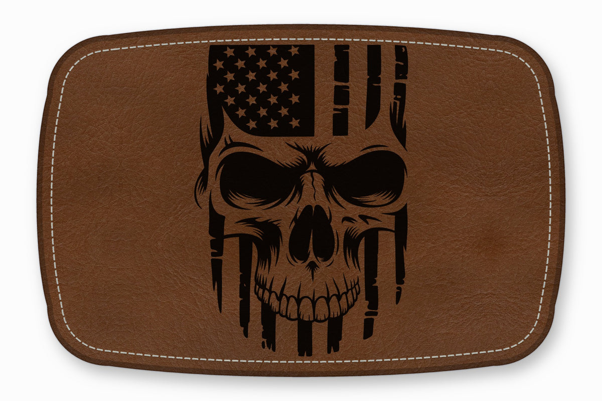 Brown leather patch with rounded corners featuring a black engraved skull and American flag design.