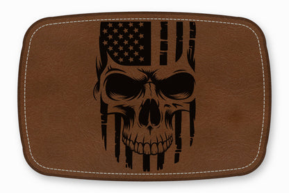 Brown leather patch with rounded corners featuring a black engraved skull and American flag design.