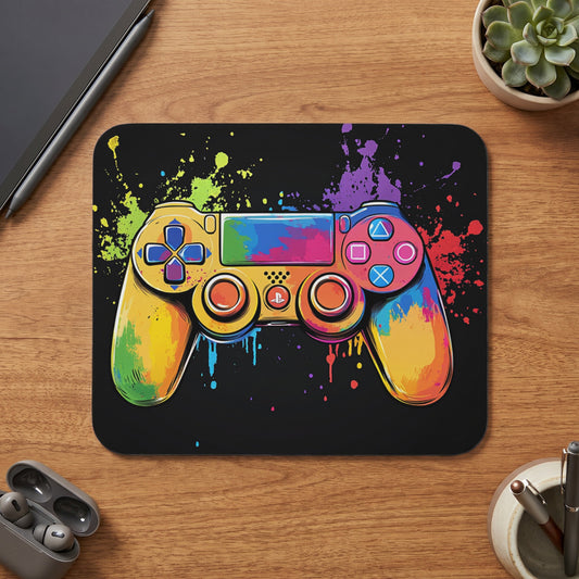 Colorful gaming controller with paint splatters on black background.