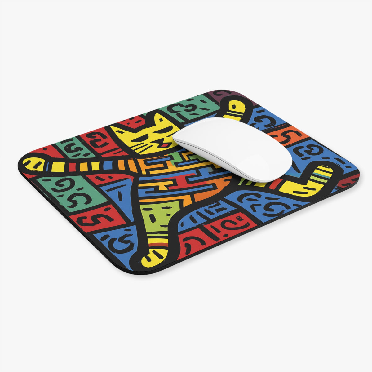 A rectangular mouse pad with a colorful, abstract cat illustration features a white computer mouse resting on top.