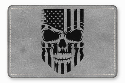 A grey leather rectangular patch with rounded corners features a distressed black American flag skull design.