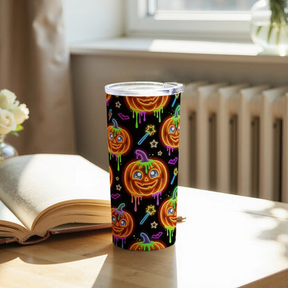 Tumbler with a repeating pattern of glowing neon Halloween pumpkins, bats, and stars on a black background.