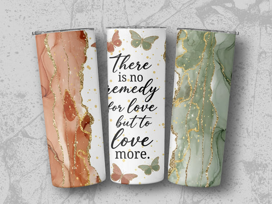 Three tumblers with marble patterns and the quote "There is no remedy for love but to love more."