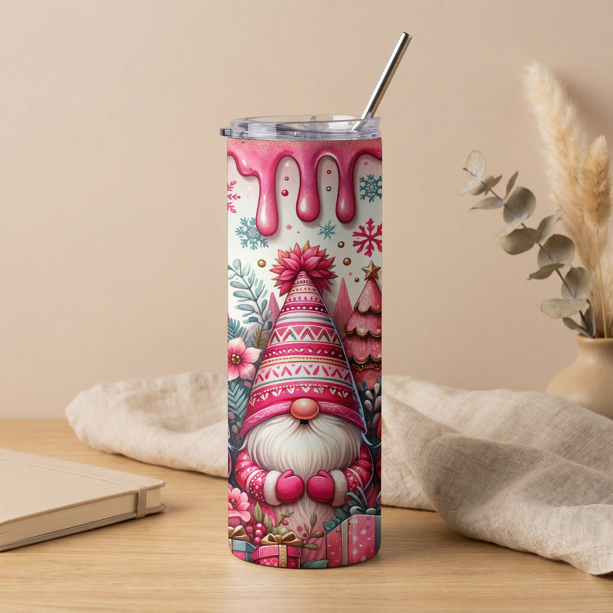Tumbler with pink gnome, gifts, snowflakes, and dripping icing design.