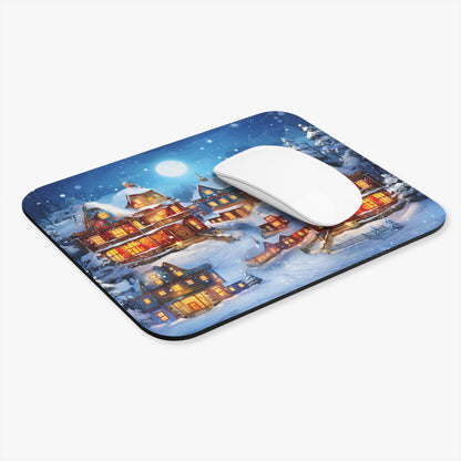 Mousepad with a watercolor painting of a cozy, snow-covered village under a full moon.