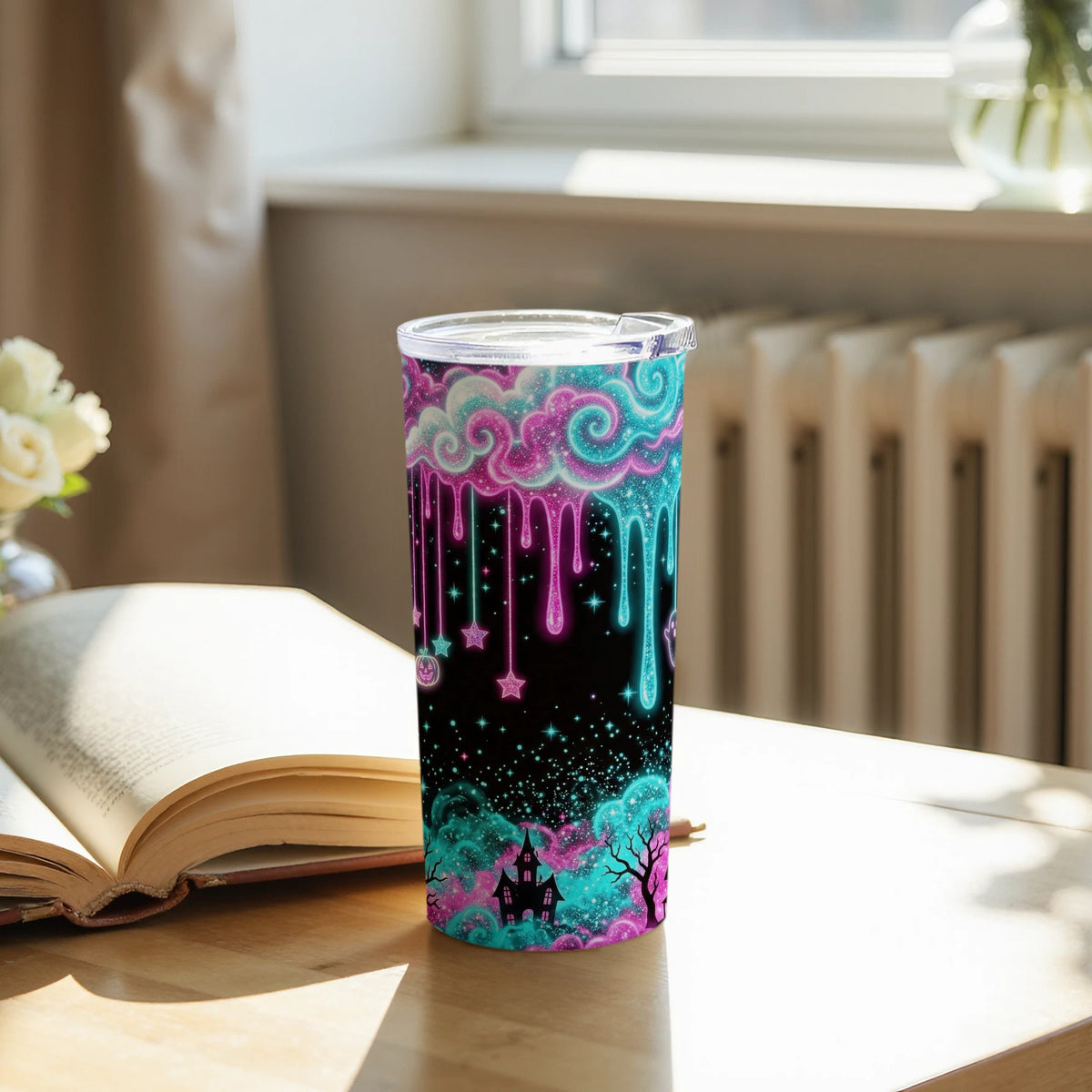 Tumbler with dripping galaxy clouds, stars, pumpkins, ghosts, and haunted house.