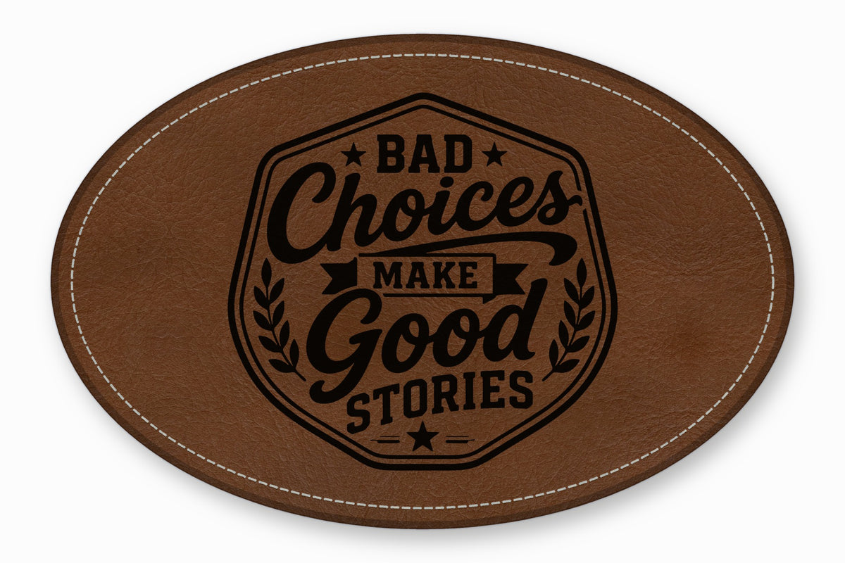An oval brown leather patch with white stitched borders and a black engraved text reading Bad Choices Make Good Stories.