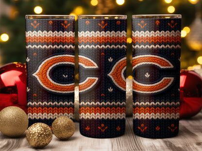 Three tumblers with a dark blue knit pattern featuring Chicago Bears logos and holiday decorations.