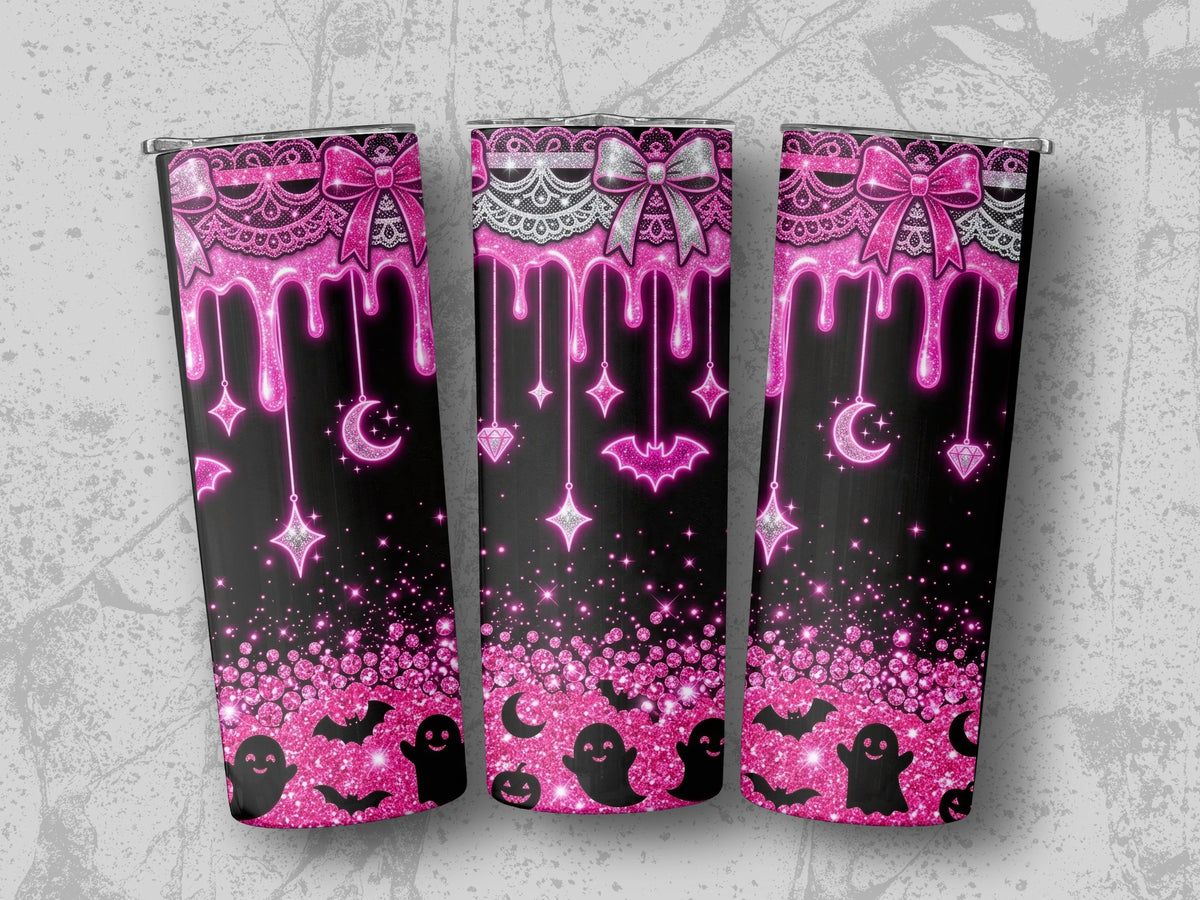 Pink glittery Halloween design with dripping icing, bows, bats, ghosts, moons, and stars.