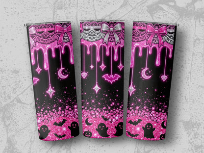 Pink glittery Halloween design with dripping icing, bows, bats, ghosts, moons, and stars.