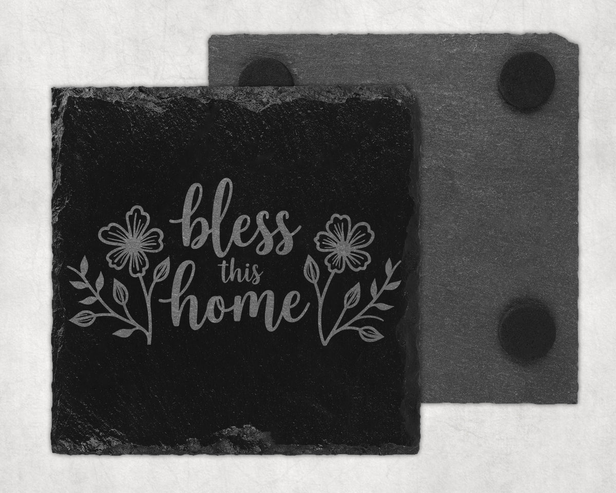 Black slate coaster with engraved floral design and "bless this home" text.